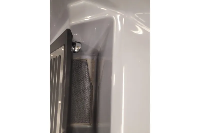 Slide: The Image of 2023 Ranger Z521R boat interior detail with metal and textured surfaces. - 1