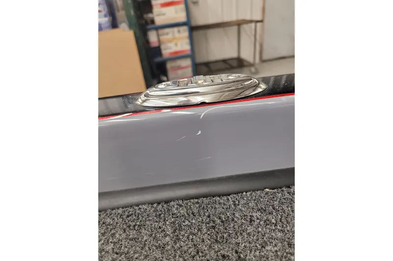 Slide: The Image of 2023 Ranger Z521R boat detail with chrome accent and gray finish. - 24