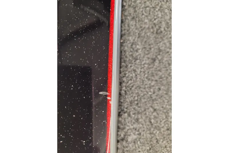 Slide: The Image of 2023 Ranger Z521R with black and red speckled finish, minor surface scratch visible. - 27