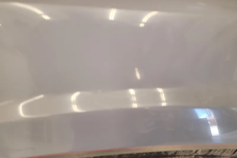 Slide: The Image of 2023 Ranger Z521R boat hull with reflective surface and lighting reflections. - 28