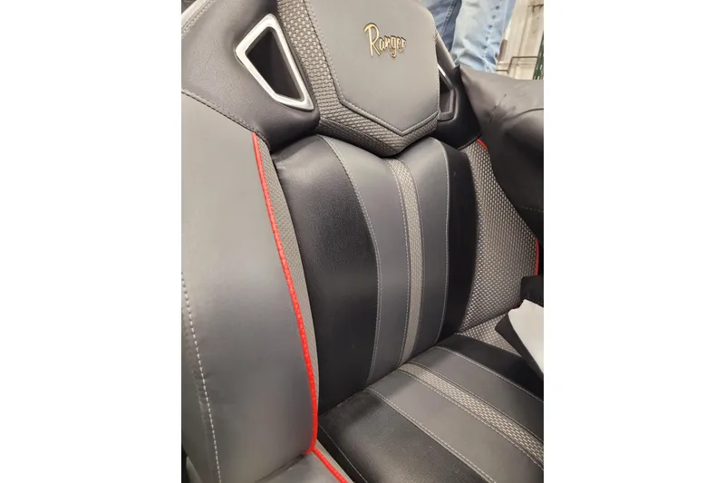 Slide: The Image of 2023 Ranger Z521R seat with black leather, red accents, and textured design. - 35