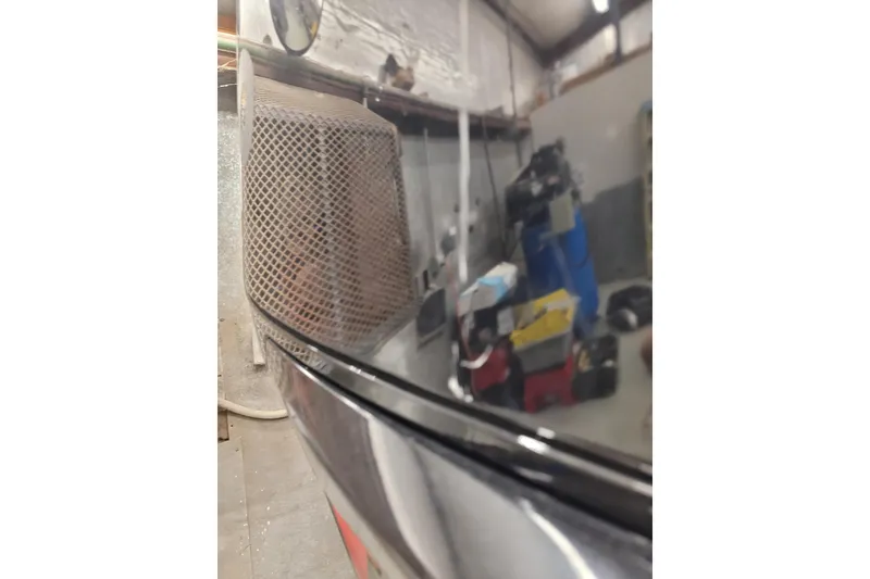 Slide: The Image of 2023 Ranger Z521R boat detail in a workshop setting. - 36