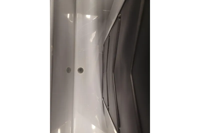 Slide: The Image of 2023 Ranger Z521R boat hull, featuring sleek design and drainage details. - 7