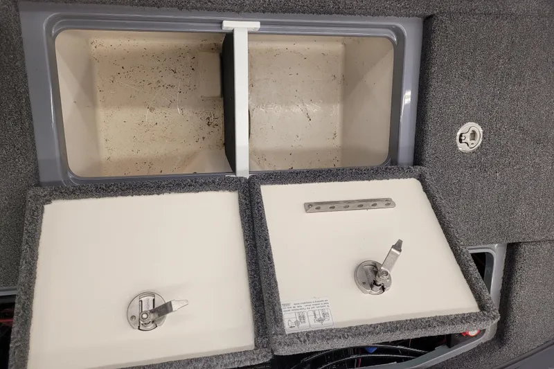 Slide: The Image of 2023 Ranger Z521R boat storage compartments with open lids, showcasing interior space. - 8