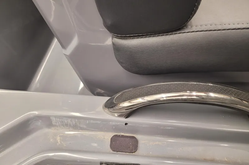Slide: The Image of 2023 Ranger Z521R boat interior detail with seat and chrome handle. - 9