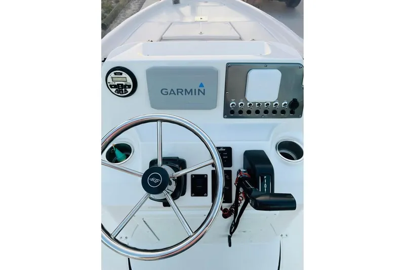 Slide: The Image of 2022 Blue Wave 2200 Classic boat console with Garmin navigation and steering wheel. - 10