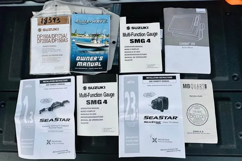 Slide: The Image of Assorted manuals for Blue Wave 2200 Classic 2022 boat and related equipment. - 11