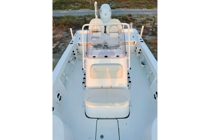 Slide: The Image of 2022 Blue Wave 2200 Classic boat interior with seating and console, viewed from above. - 13