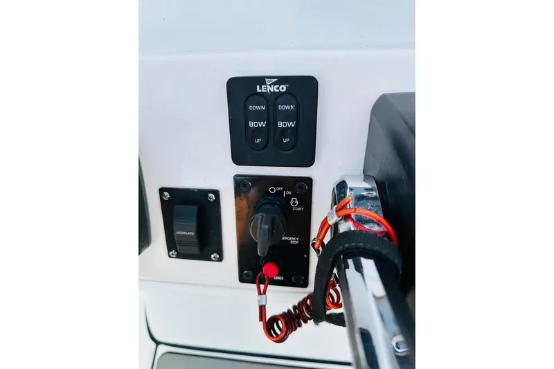 Slide: The Image of Control panel of 2022 Blue Wave 2200 Classic boat with Lenco trim tab switches. - 8