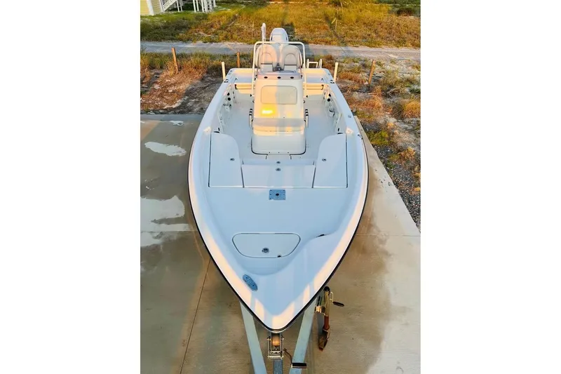 Slide: The Image of 2022 Blue Wave 2200 Classic boat on a concrete driveway, viewed from above. - 9
