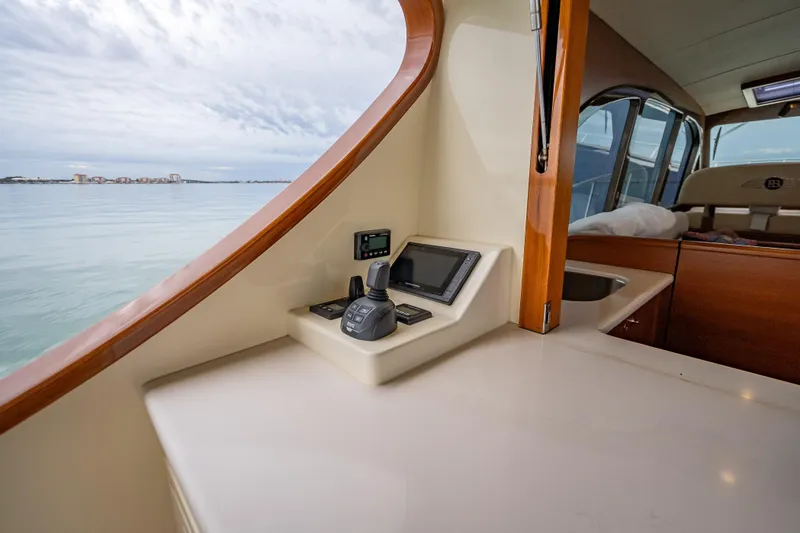 Slide: The Image of 2020 Palm Beach Motor Yachts PB50 interior with control panel and scenic ocean view. - 13