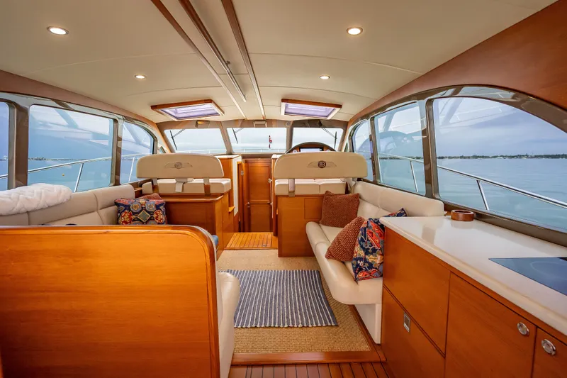 Slide: The Image of Luxurious interior of 2020 Palm Beach Motor Yachts PB50, featuring elegant wood finishes and plush seating. - 20