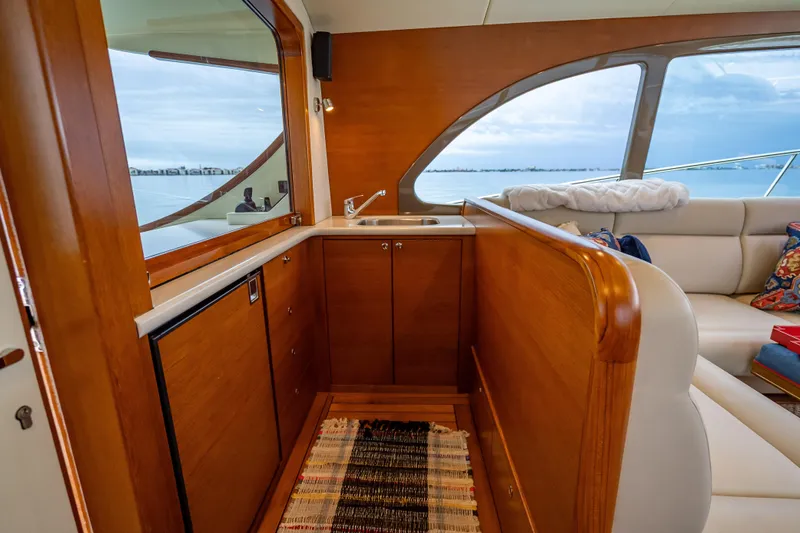 Slide: The Image of Luxurious interior of 2020 Palm Beach Motor Yachts PB50 with wood finish and ocean view. - 21