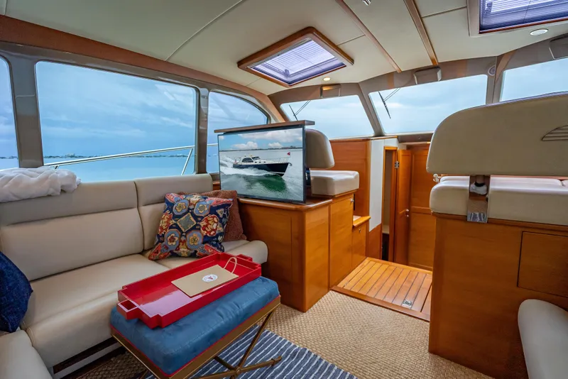 Slide: The Image of Luxurious interior of 2020 Palm Beach Motor Yachts PB50 with elegant seating and scenic views. - 28