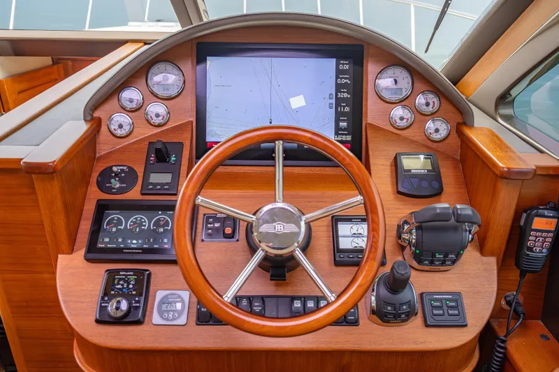 Slide: The Image of Helm of 2020 Palm Beach Motor Yachts PB50, featuring advanced navigation and control systems. - 31