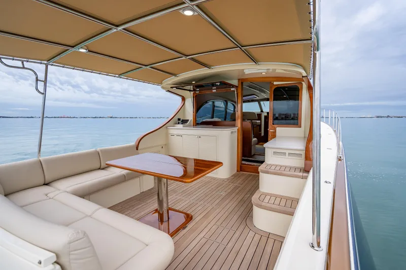 Slide: The Image of Luxurious 2020 Palm Beach Motor Yachts PB50 with elegant deck and seating area. - 7
