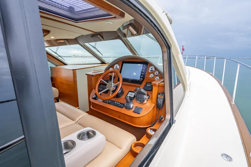 Slide: The Image of 2020 Palm Beach Motor Yachts PB50 helm with modern navigation controls and luxurious interior. - 15
