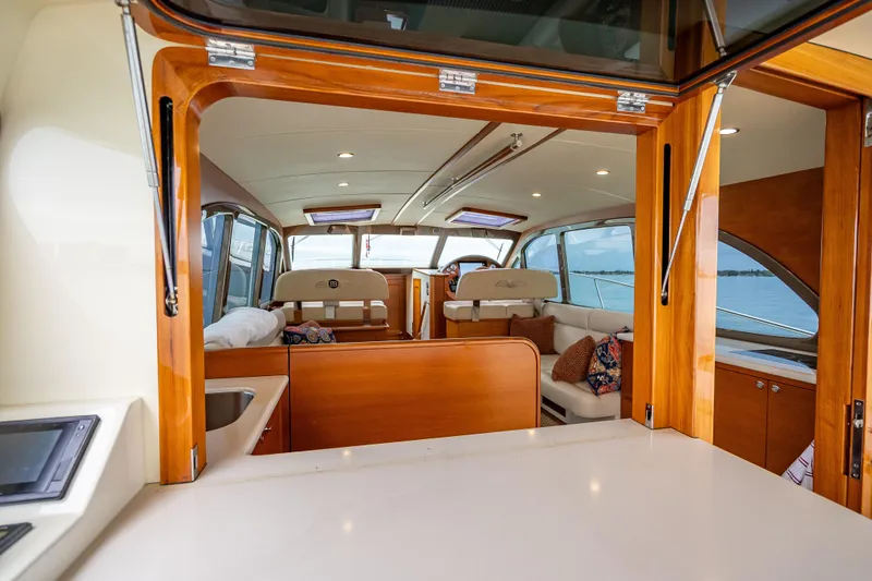 Slide: The Image of Luxurious interior of 2020 Palm Beach Motor Yachts PB50, featuring elegant wood finishes. - 18