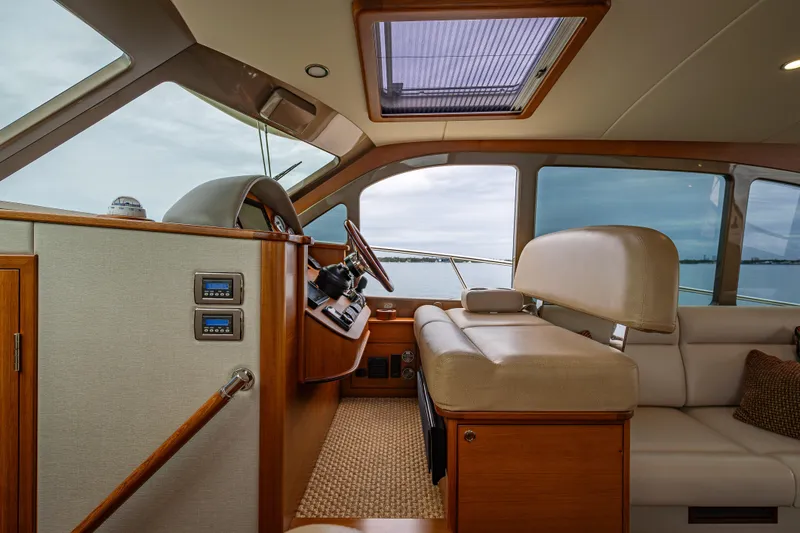 Slide: The Image of Luxurious interior of 2020 Palm Beach Motor Yachts PB50, featuring elegant seating and helm. - 33