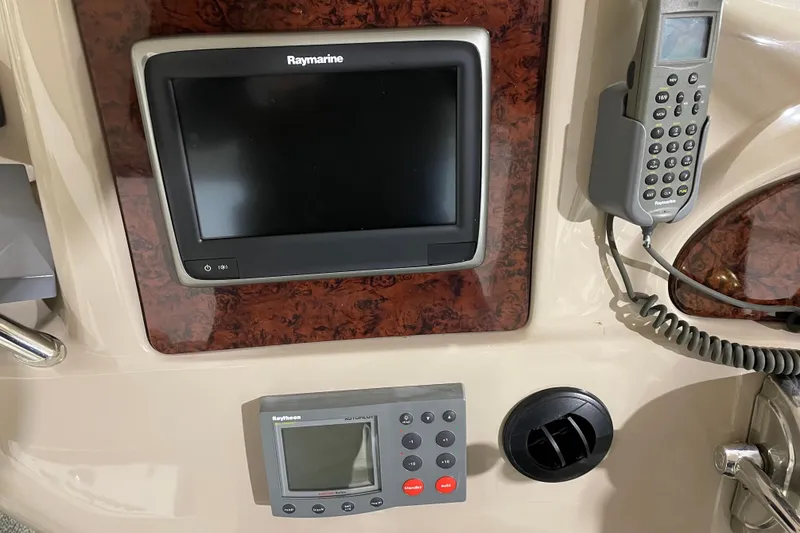 Slide: The Image of Control panel of a 2001 Sea Ray Sundancer 460 with Raymarine electronics. - 11