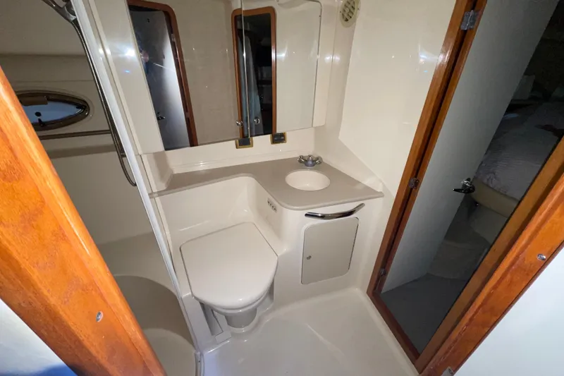 Slide: The Image of 2001 Sea Ray Sundancer 460 yacht bathroom with compact design and modern amenities. - 12