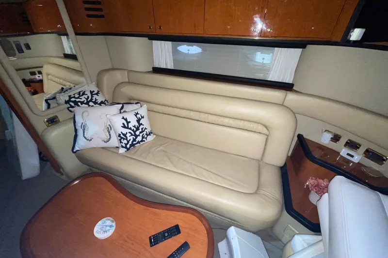 Slide: The Image of Luxurious interior of 2001 Sea Ray Sundancer 460 yacht with beige leather seating. - 13