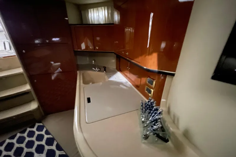 Slide: The Image of Interior of 2001 Sea Ray Sundancer 460 yacht with sleek cabinetry and modern design. - 15