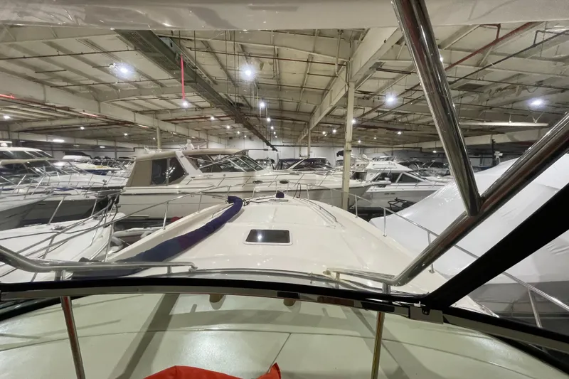 Slide: The Image of Indoor storage of 2001 Sea Ray Sundancer 460 yacht among other boats. - 17