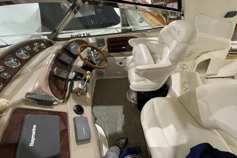 Slide: The Image of Cockpit of 2001 Sea Ray Sundancer 460 with steering wheel and navigation equipment. - 18