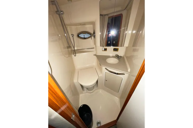 Slide: The Image of Bathroom interior of 2001 Sea Ray Sundancer 460 yacht, featuring shower and sink. - 22