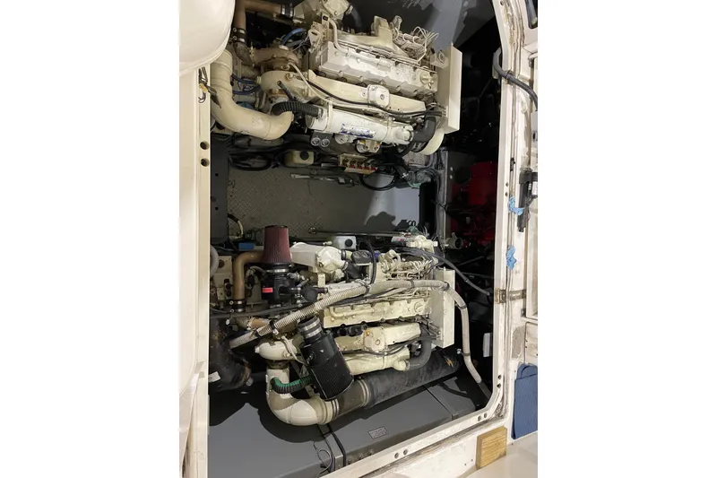 Slide: The Image of Engine room of 2001 Sea Ray Sundancer 460 yacht, showcasing dual engines. - 27