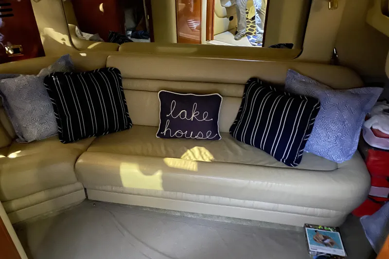 Slide: The Image of Interior of 2001 Sea Ray Sundancer 460 with cozy sofa and decorative pillows. - 28