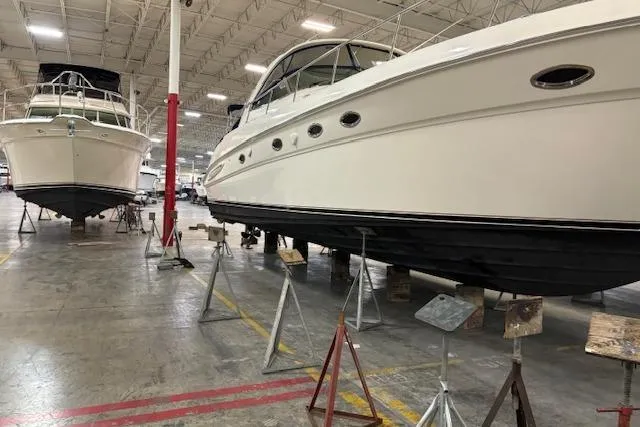 Slide: The Image of 2001 Sea Ray 460 Sundancer yacht in indoor storage facility. - 6