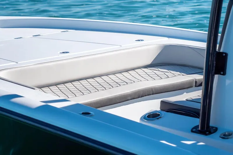 Slide: The Image of 2026 Barker Boatworks 26 Calibogue Bay, featuring sleek seating and modern design on blue water. - 10
