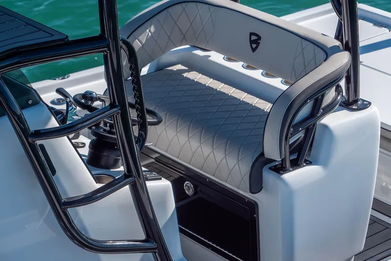 Slide: The Image of 2026 Barker Boatworks 26 Calibogue Bay helm seat with diamond-stitched upholstery. - 11