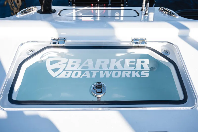 Slide: The Image of Barker Boatworks 26 Calibogue Bay 2026 model, featuring a sleek livewell design. - 12