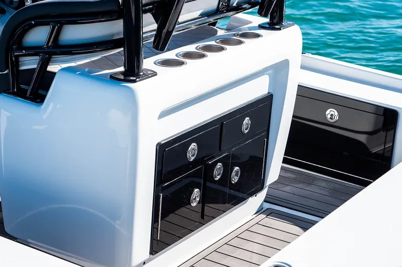 Slide: The Image of 2026 Barker Boatworks 26 Calibogue Bay, sleek console design with storage and cup holders. - 16