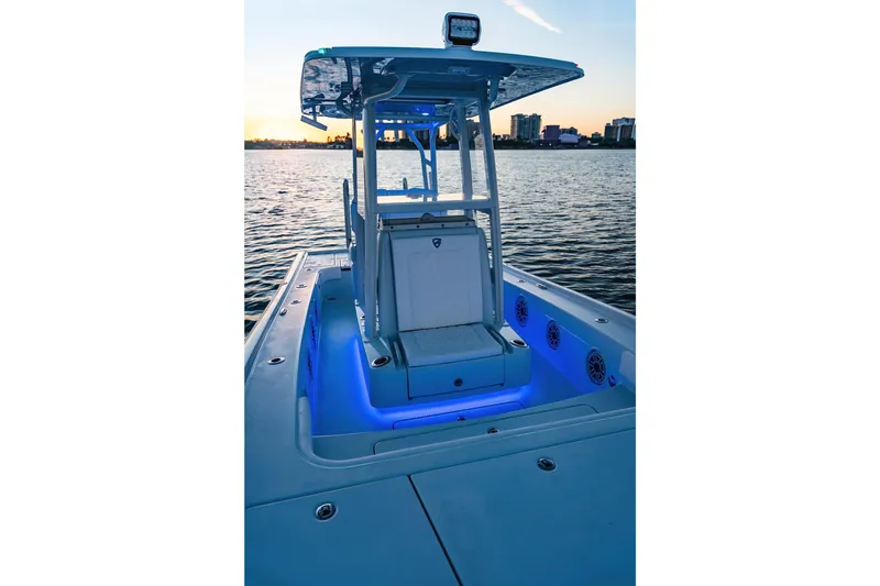 Slide: The Image of 2026 Barker Boatworks 26 Calibogue Bay with blue LED lights at sunset on the water. - 8