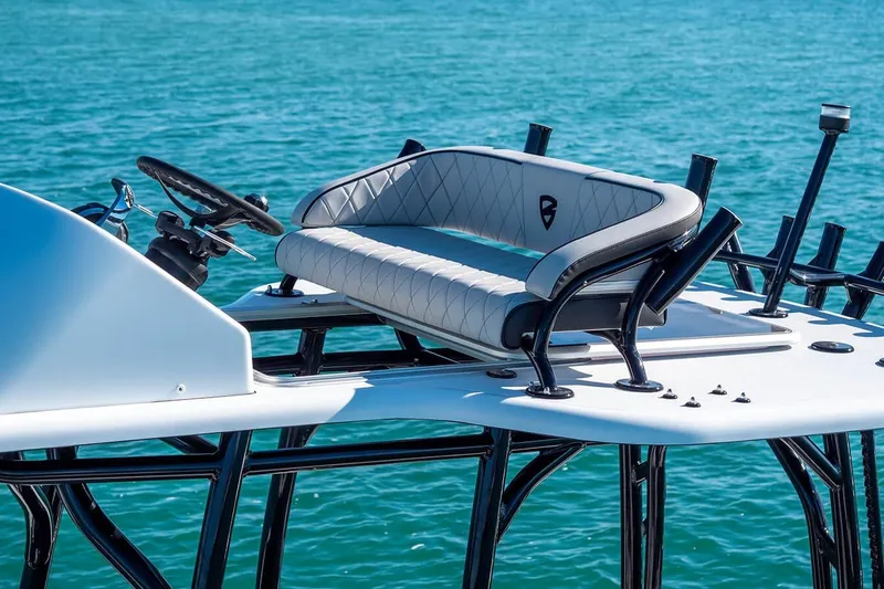 Slide: The Image of 2026 Barker Boatworks 26 Calibogue Bay helm with luxurious seating on blue water. - 15