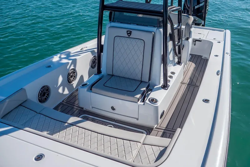 Slide: The Image of 2026 Barker Boatworks 26 Calibogue Bay interior with sleek seating and modern design on water. - 9