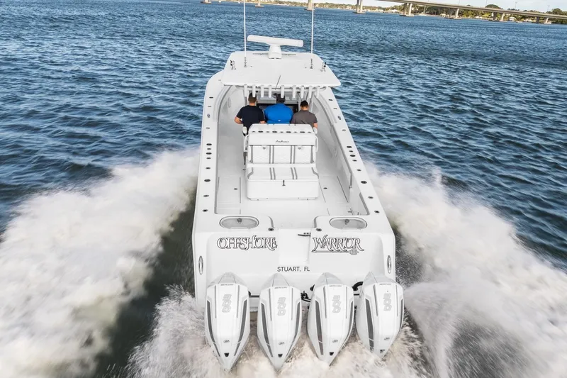 The Image of 2021 SeaHunter 39 Tournament boat cruising on open water with four powerful engines. - 0