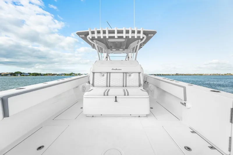 Slide: The Image of 2021 SeaHunter 39 Tournament boat interior with seating, ocean view, and clear sky. - 11