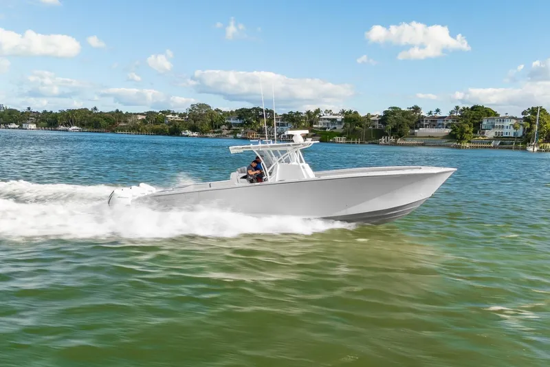 Slide: The Image of 2021 SeaHunter 39 Tournament boat cruising on a sunny day in a scenic waterway. - 17