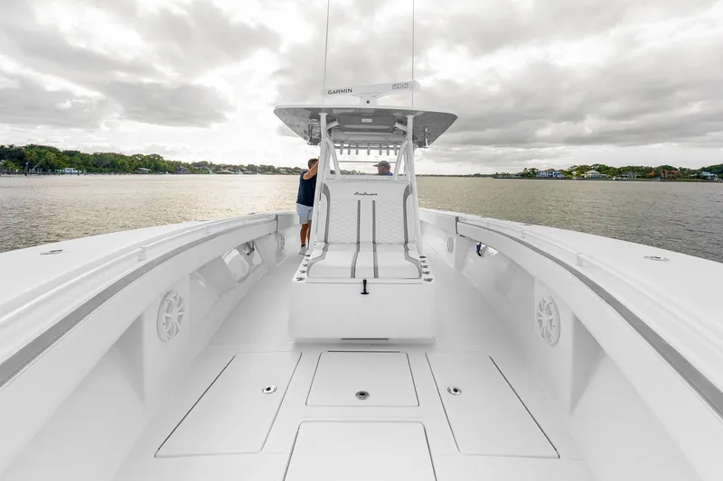 Slide: The Image of 2021 SeaHunter 39 Tournament boat on calm waters under cloudy sky. - 4