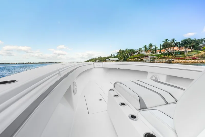 Slide: The Image of 2021 SeaHunter 39 Tournament boat interior with coastal view, clear sky, and luxurious seating. - 5