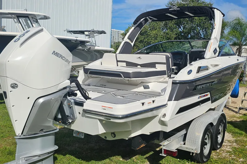 Slide: The Image of 2020 Monterey 275SS Super Sport boat with Mercury engine on trailer. - 2