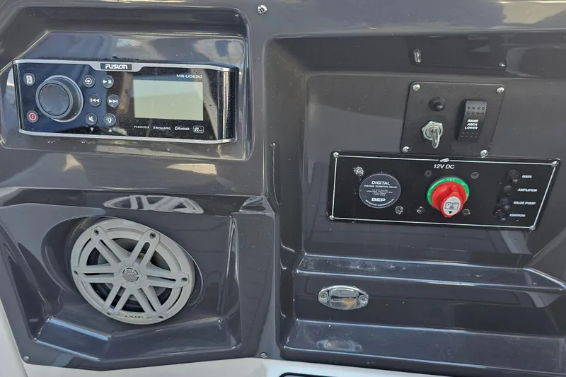 Slide: The Image of Control panel of 2020 Monterey 275SS Super Sport boat with audio system and switches. - 22