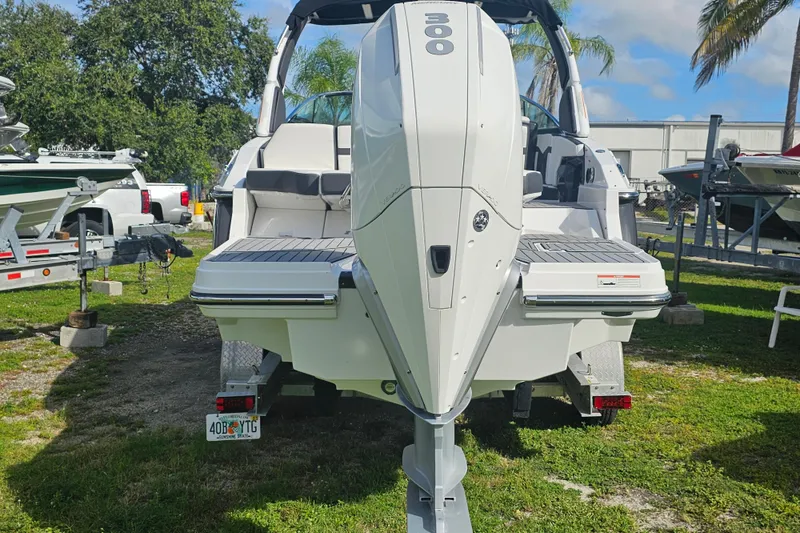 Slide: The Image of 2020 Monterey 275SS Super Sport boat with powerful outboard engine, parked on trailer. - 3
