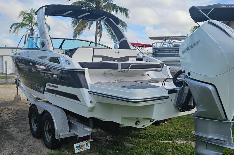 Slide: The Image of 2020 Monterey 275SS Super Sport boat on trailer with Mercury outboard, palm trees in background. - 4