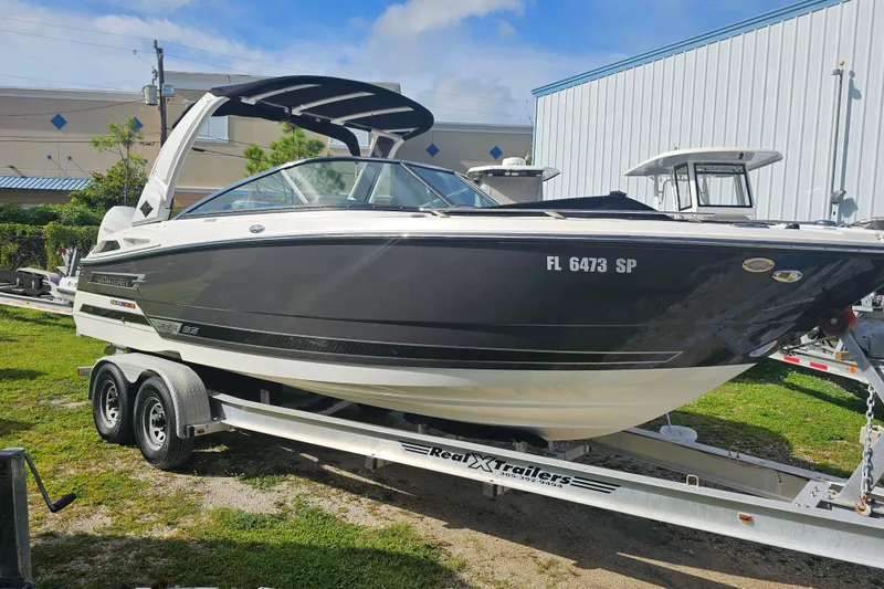 Slide: The Image of 2020 Monterey 275SS Super Sport boat on trailer, parked outdoors. - 6